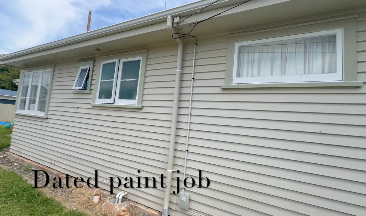 Dated Hamilton weatherboard exterior and original window frames before window sill restoration