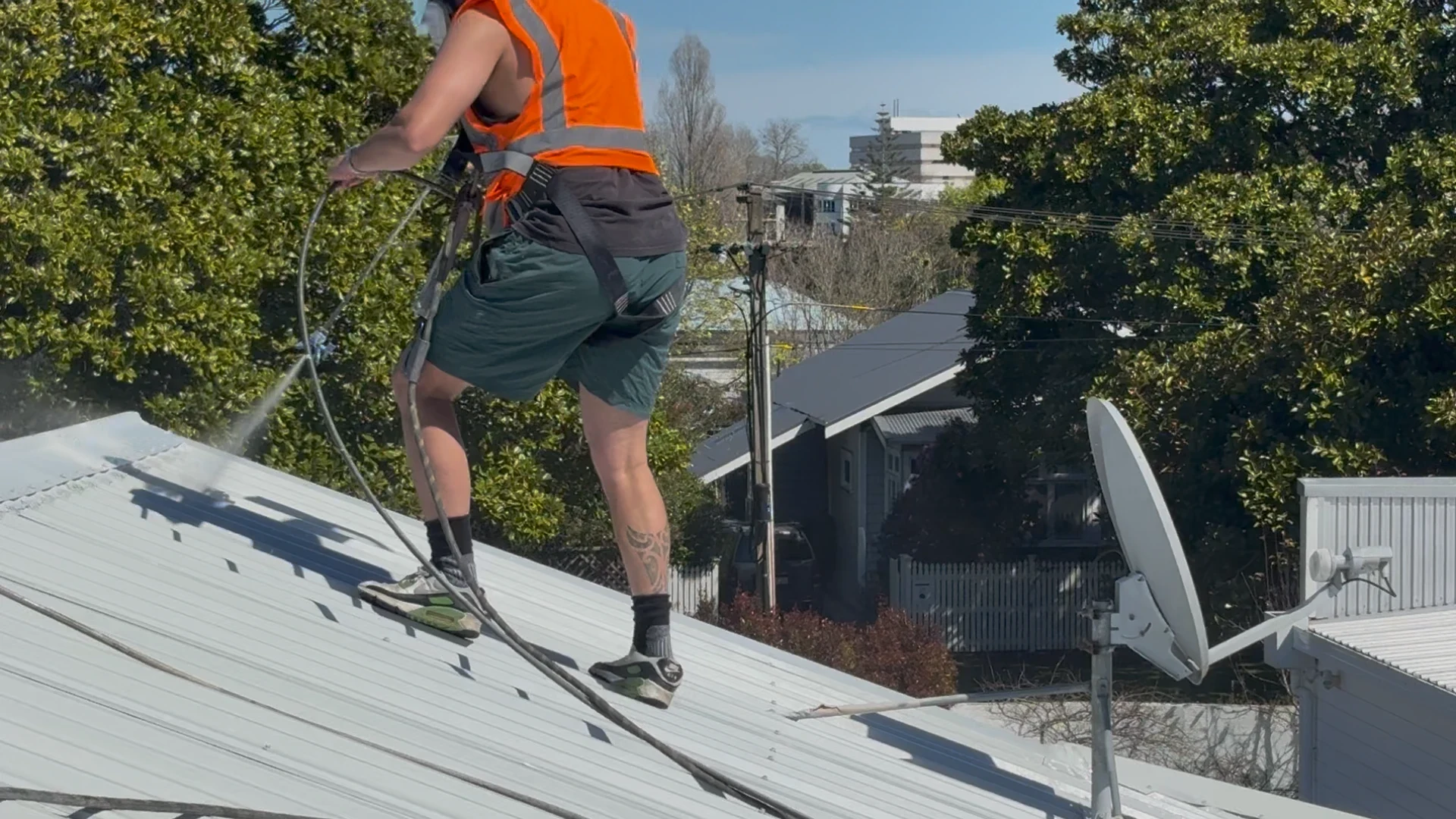 Tomar Contracting team water blasting roof